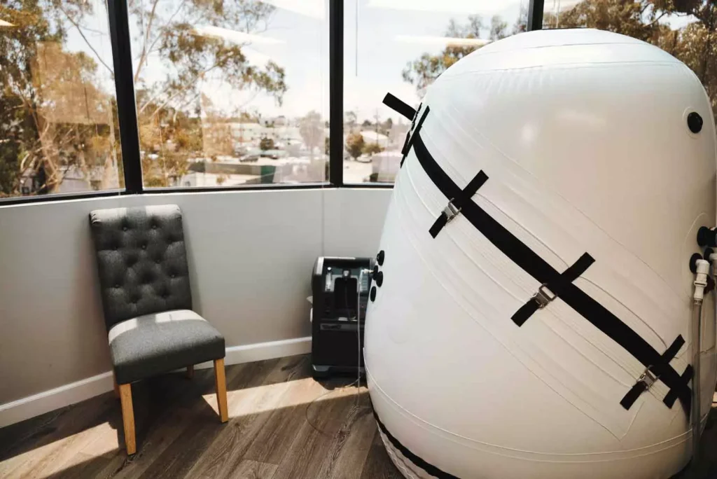 An upright soft-sided mild hyperbaric chamber at K Wellness in Long Beach