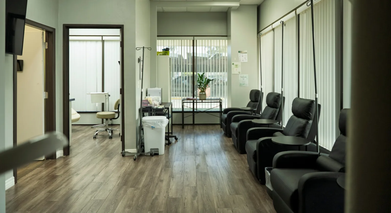 The K Wellness IV room, with reclining chairs and IV poles along the windows